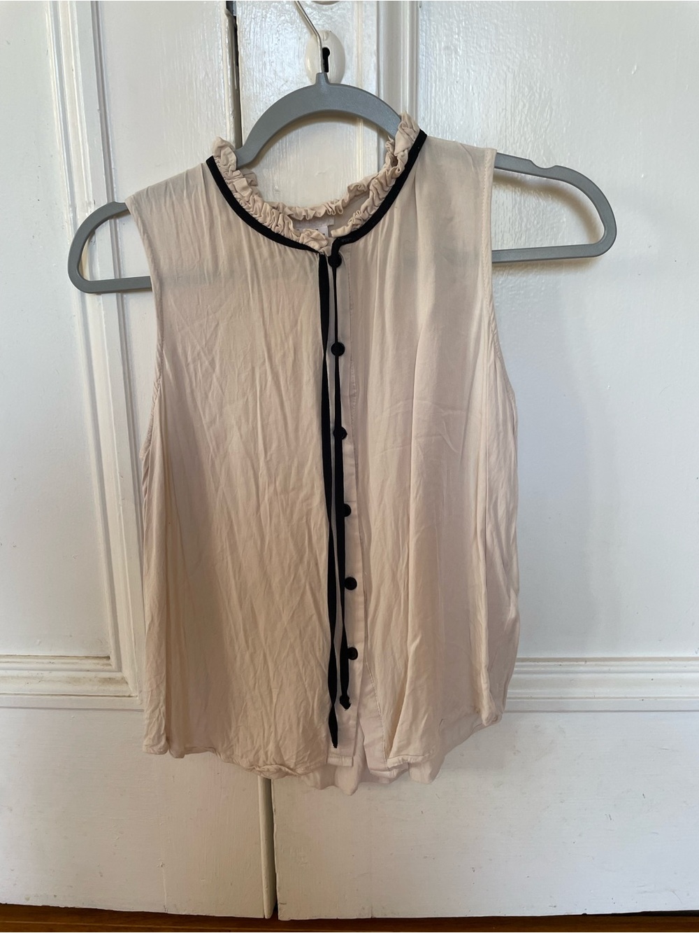 Sleeveless Ruffle-Neck Blouse in Cream with Black Trim